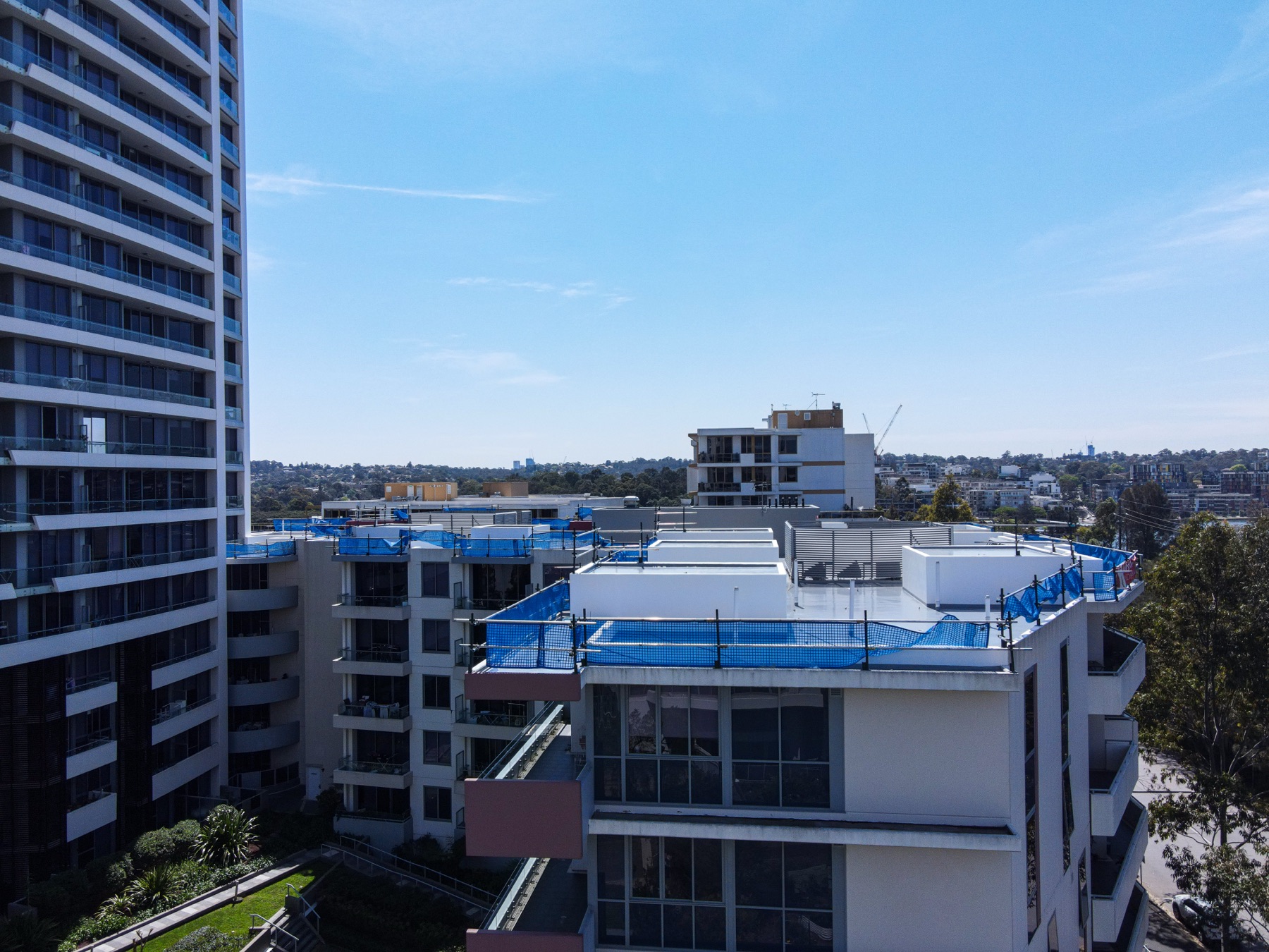 Aerial drone photo of a rooftop edge protection install in Rhodes