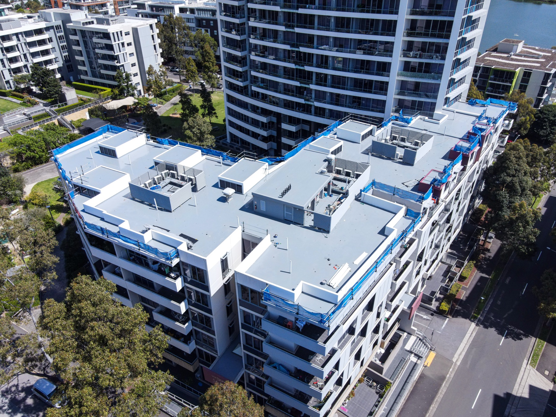 Aerial drone photo of a rooftop edge protection install in Rhodes