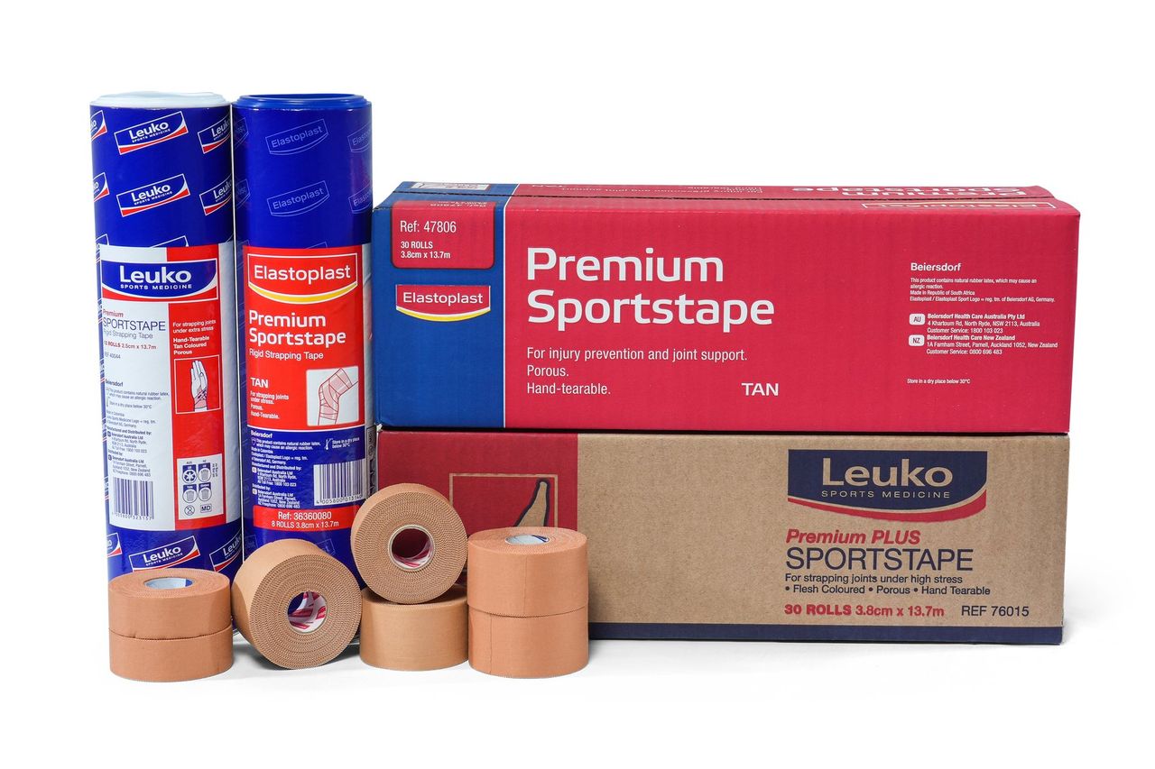 Elastoplast and Leuko sportstape boxes and rolls grouped together on a white background