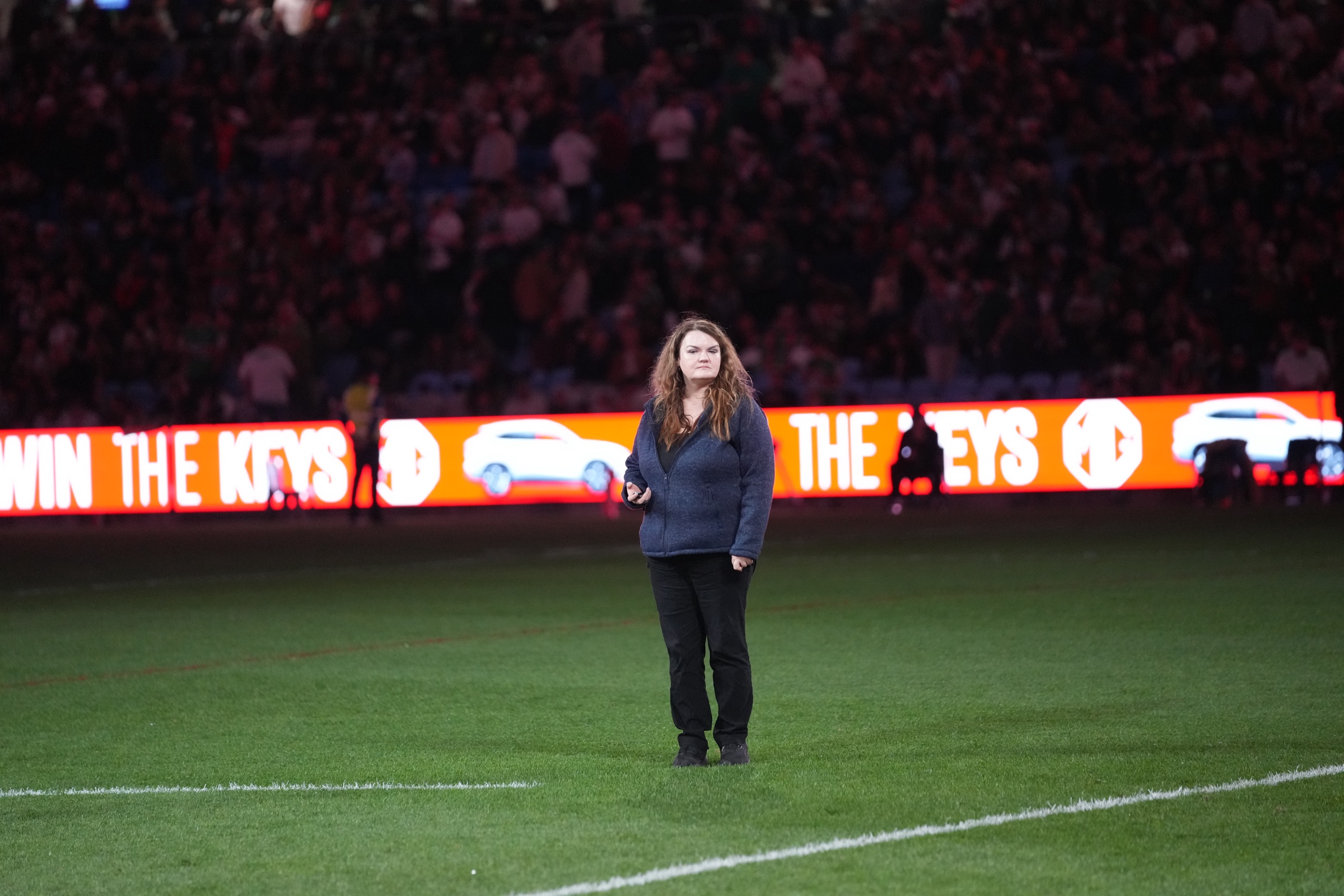 Win the Keys LED ribbon board running the perimeter at Allianz Stadium, on-field host in view