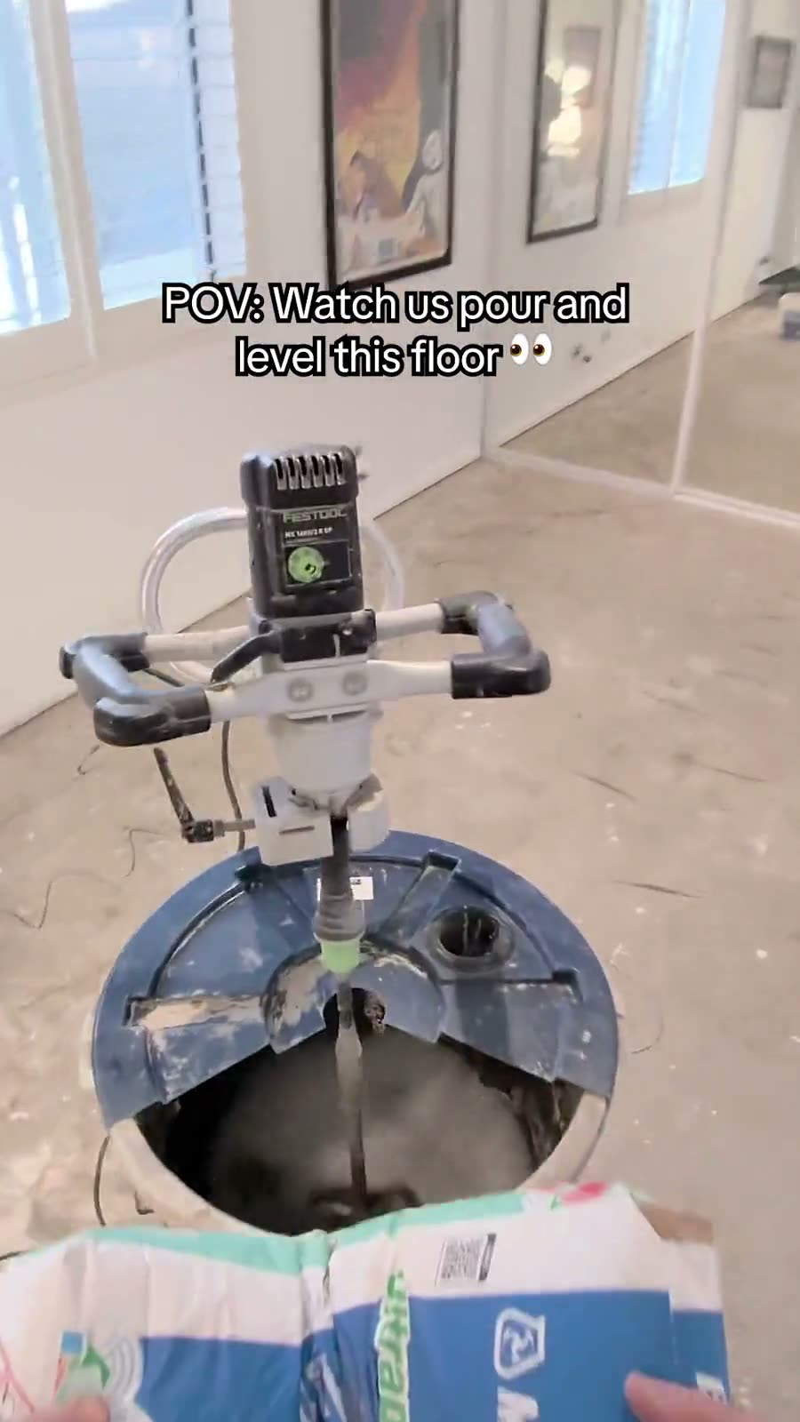 POV video still of concrete pouring and levelling, filmed on Meta smart glasses